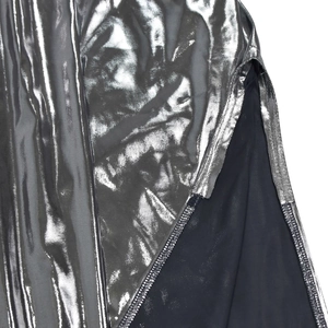 Close-up of metallic silver fabric texture with detailed stitching and black lining