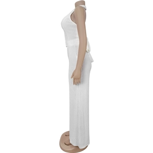 Detail shot of white pleated fabric texture on the side of a sleeveless women's two-piece set