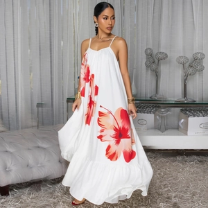 Women's floral spaghetti strap dress with orange flowers and ruffled hemline