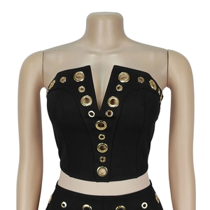 Detail of black V-neck tube top with symmetrical gold eyelets and elastic fabric