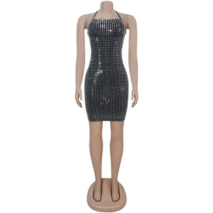 Close-up of black bodycon halter dress featuring shiny silver rhinestone grid patterns