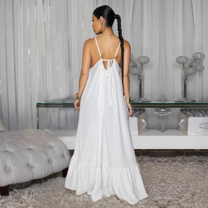 Elegant white backless maxi dress with floral print and ruffled hem for summer vacation