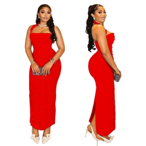Detail of red halter neck bodycon dress featuring intricate beaded pearl embellishments