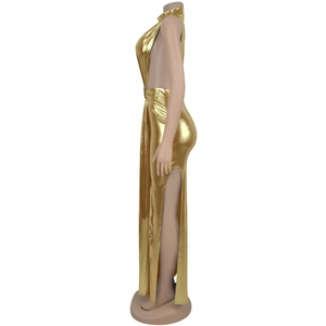 Detail view of gold metallic dress showing side cut-outs and ring hardware detail