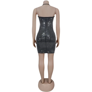 Close-up back view of black mini dress with shimmering silver rhinestones detail