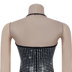 Close-up of black halter dress with silver square rhinestones and back zipper detail