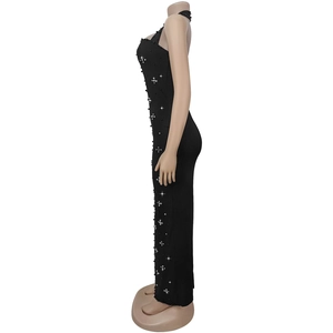 Detail view of black bodycon dress with side beadwork and sparkling rhinestones