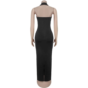 Detail of black halter neck dress featuring beadwork and an open back with invisible zipper