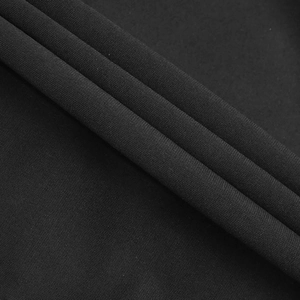 Close-up of high-density black knit fabric with detailed texture and soft elastic feel