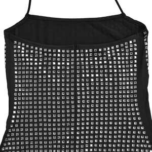 Close-up back view of black sequined halter top with square silver sequins and hidden zipper