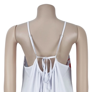 Close-up of adjustable back straps on this white floral print dress with tie-up detail