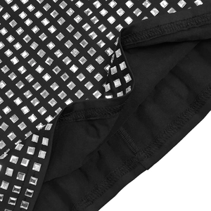 Close-up of black dress fabric with silver square rhinestones in a grid layout