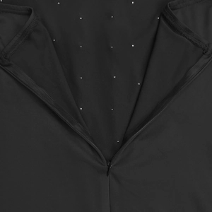 Detail of invisible zipper and silver rhinestones on black evening dress fabric