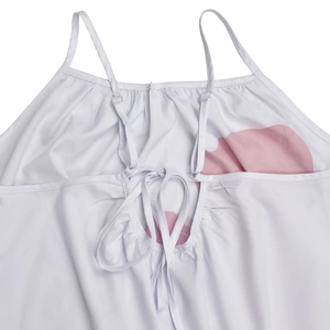 Detail of adjustable straps and back lace-up tie on white floral backless dress