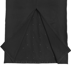 Detail of black halter dress featuring a stylish inverted V-slit and sparkling rhinestone trim
