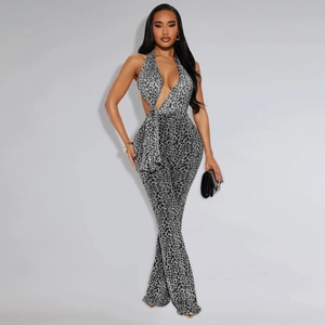 Detailed view of women's leopard print halter jumpsuit with waist cutouts and V-neckline