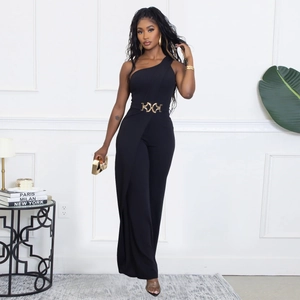 Detail of elegant black one-shoulder jumpsuit featuring a gold geometric waist buckle
