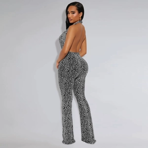 Detailed view of backless halter jumpsuit with leopard print and flared leg design