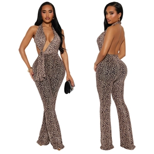 Macro detail of sexy leopard print jumpsuit with halter V-neck and flare leg design