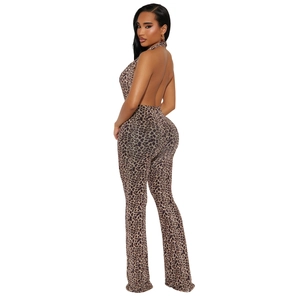Detail view of backless leopard print jumpsuit with halter neck and flared leg fit