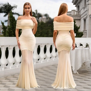 Detail of off-shoulder beige mermaid dress with horizontal ruffles and sheer mesh hem