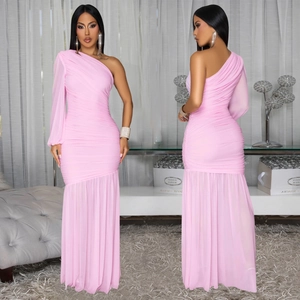 Detail view showing pink one-shoulder ruched dress with sheer mesh long sleeve and fishtail