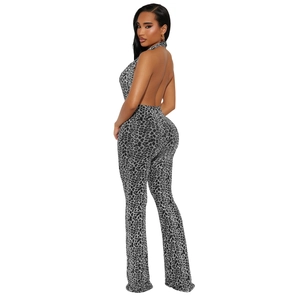 Detail of backless halter jumpsuit featuring leopard print and slim fit silhouette
