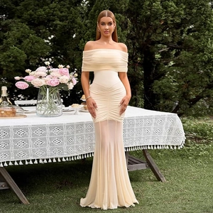 Detail of cream off-shoulder mesh maxi dress with ruched bodice and sheer fishtail hem