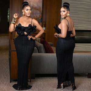 Detailed view of the 3D floral accents and sheer knit texture on this black bodycon maxi dress