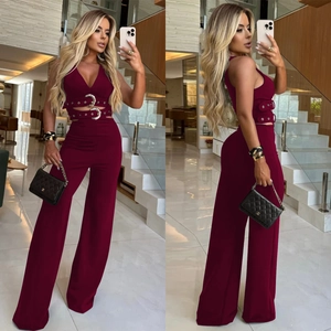Detail of burgundy V-neck top with buckle belt and matching wide-leg trousers set