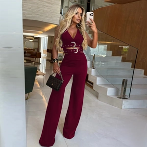 Deep burgundy V-neck sleeveless top with decorative belts and matching wide leg trousers
