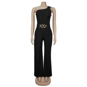 Detail of elegant black one-shoulder jumpsuit with a gold buckle belt on mannequin
