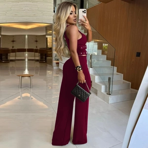 Detail view of burgundy two-piece set featuring decorative eyelets and wide-leg trousers