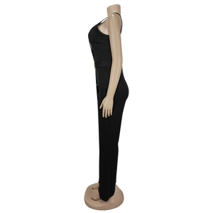 Detail view of the black sleeveless jumpsuit with an elegant gold circular waist buckle