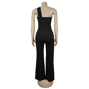 Rear view detail of a black one-shoulder jumpsuit featuring a hidden back zipper