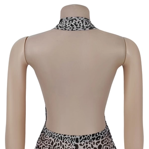 Detail view of leopard print halter neck jumpsuit featuring an open back design