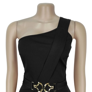 Detail of elegant black one-shoulder dress with a decorative gold interlocking metal buckle
