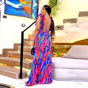 Elegant backless maxi dress with colorful abstract print and ruffled shoulder straps