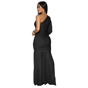 Detail of elegant black one-shoulder maxi dress with ruched fabric and mermaid hem