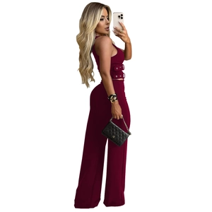 Detail view of burgundy sleeveless top with side eyelets and matching wide leg trousers