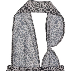 Close-up of leopard print pattern and halter neckline on a women's jumpsuit