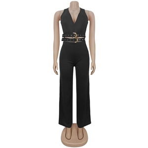 Detail of a black jumpsuit featuring a deep V-neck and waist belt with golden snake buckle
