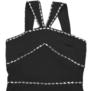 Detail of elegant black dress showing V-shaped crystal rhinestone trim on the straps