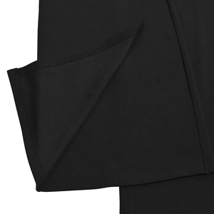 Close-up detail of the precision stitching and hem finish on a black elegant jumpsuit