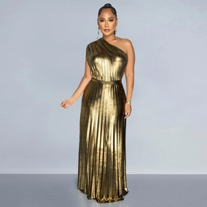 Close-up of elegant gold pleated fabric with a metallic finish and chic shoulder detail