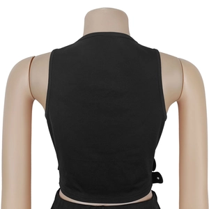 Detail view of black sleeveless crop top back with metal buckle accents and clean finish