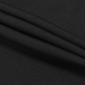 Close-up of premium black knitted fabric showing fine texture and elegant drape