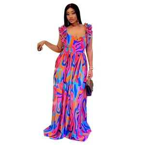 Close-up of ruffled shoulder straps and abstract floral print on an elegant maxi dress