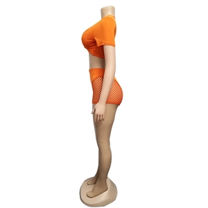 Detail view of bright orange two-piece mesh swimsuit set on a side-facing mannequin