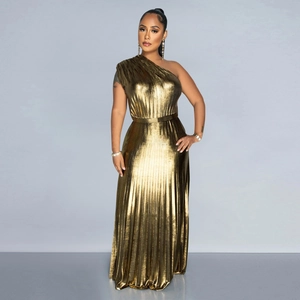 Detail of elegant gold one-shoulder maxi dress with pleated texture and metallic finish